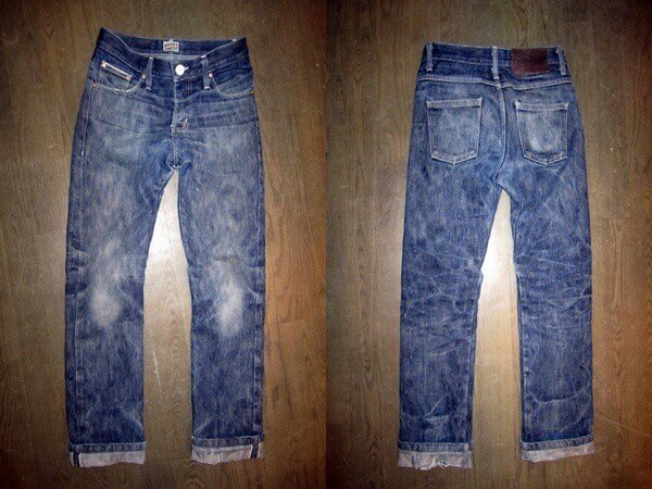 Faded Naked & Famous jeans with a deep blue waterfall pattern